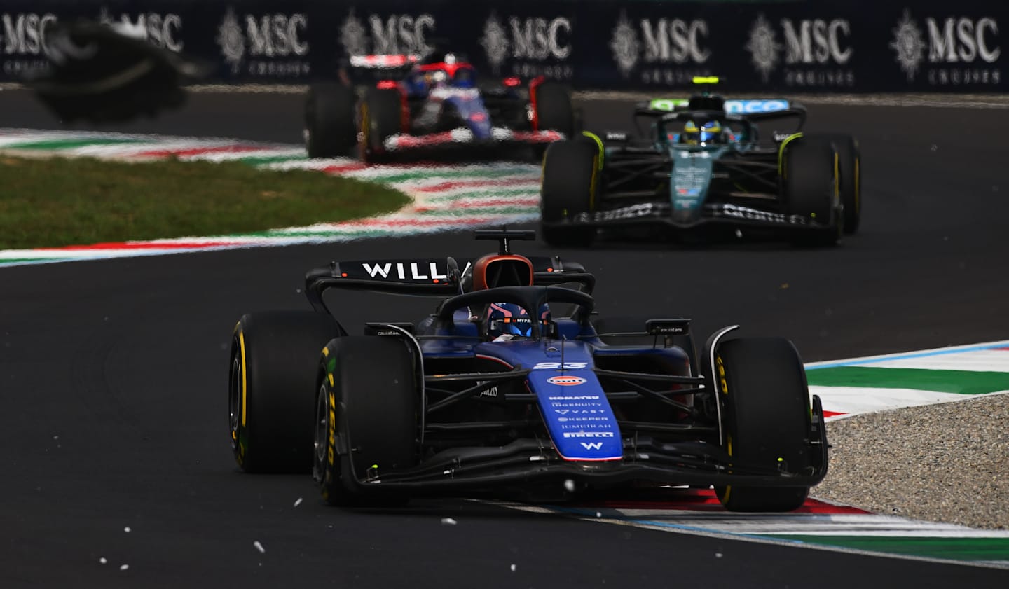 MONZA, ITALY - SEPTEMBER 01: Alexander Albon of Thailand driving the (23) Williams FW46 Mercedes leads Fernando Alonso of Spain driving the (14) Aston Martin AMR24 Mercedes on track during the F1 Grand Prix of Italy at Autodromo Nazionale Monza on September 01, 2024 in Monza, Italy. (Photo by Rudy Carezzevoli/Getty Images)