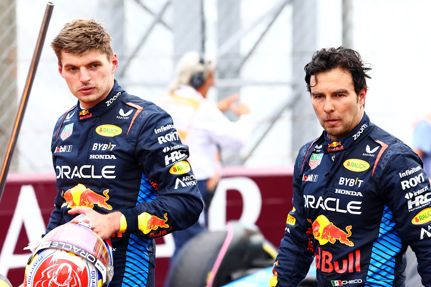 MONZA, ITALY - SEPTEMBER 01: Sixth place Max Verstappen of the Netherlands and Oracle Red Bull Racing and eighth place Sergio Perez of Mexico and Oracle Red Bull Racing, look on in parc ferme  during the F1 Grand Prix of Italy at Autodromo Nazionale Monza on September 01, 2024 in Monza, Italy. (Photo by Mark Thompson/Getty Images)