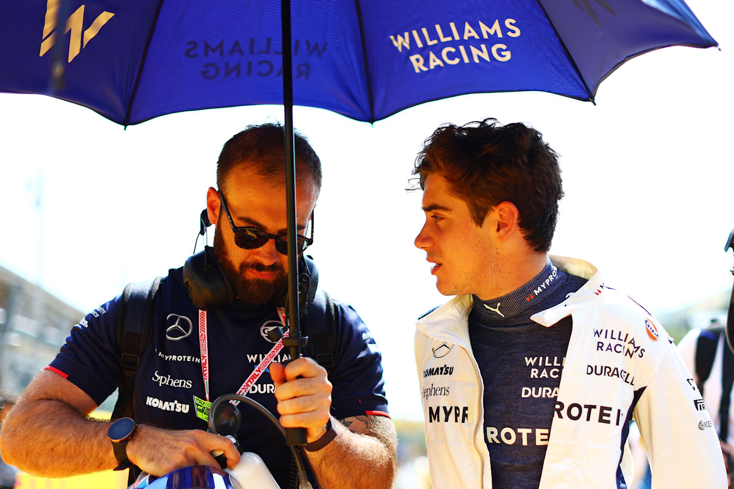 MONZA, ITALY - SEPTEMBER 01: Franco Colapinto of Argentina and Williams talks to a Williams team member during the F1 Grand Prix of Italy at Autodromo Nazionale Monza on September 01, 2024 in Monza, Italy. (Photo by Clive Rose/Getty Images)