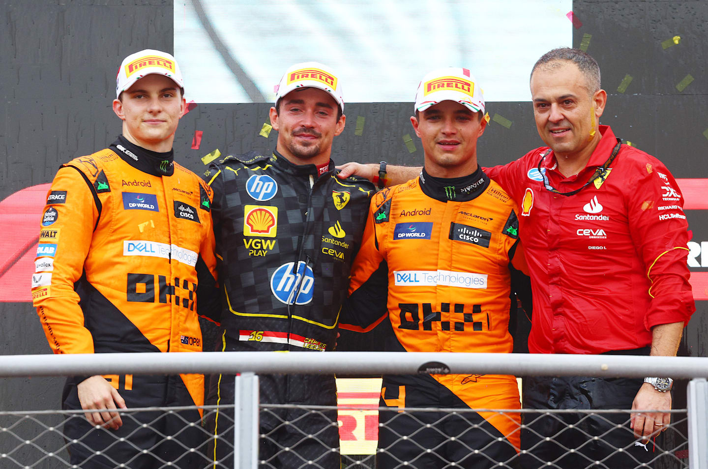 MONZA, ITALY - SEPTEMBER 01: Race winner Charles Leclerc of Monaco and Ferrari, with Second placed Oscar Piastri of Australia and McLaren, Third placed Lando Norris of Great Britain and McLaren and Diego Ioverno of Ferrari during the F1 Grand Prix of Italy at Autodromo Nazionale Monza on September 01, 2024 in Monza, Italy. (Photo by Clive Rose/Getty Images)