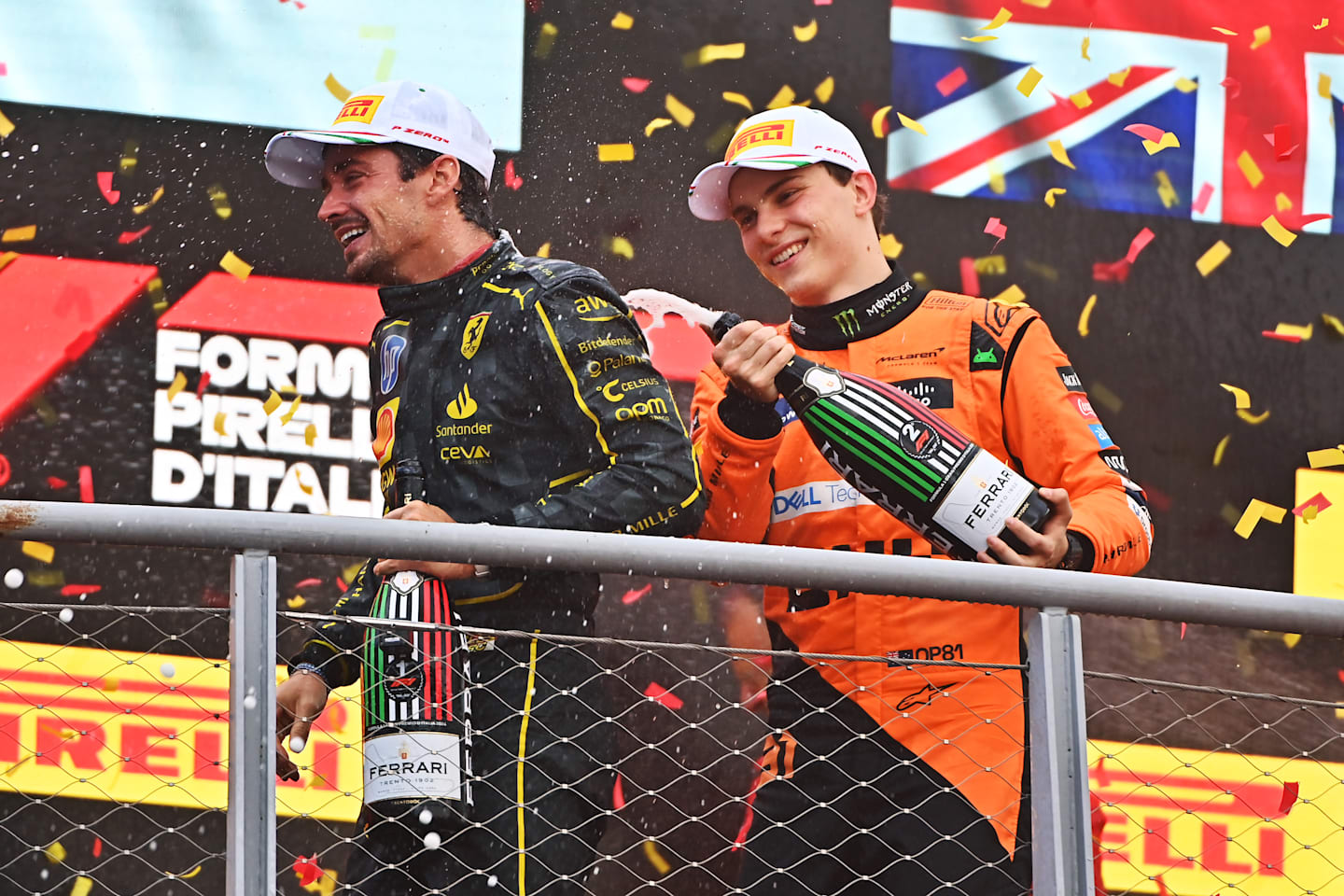 MONZA, ITALY - SEPTEMBER 01: Race winner Charles Leclerc of Monaco and Ferrari and Second placed Oscar Piastri of Australia and McLaren celebrates on the podium during the F1 Grand Prix of Italy at Autodromo Nazionale Monza on September 01, 2024 in Monza, Italy. (Photo by James Sutton - Formula 1/Formula 1 via Getty Images)