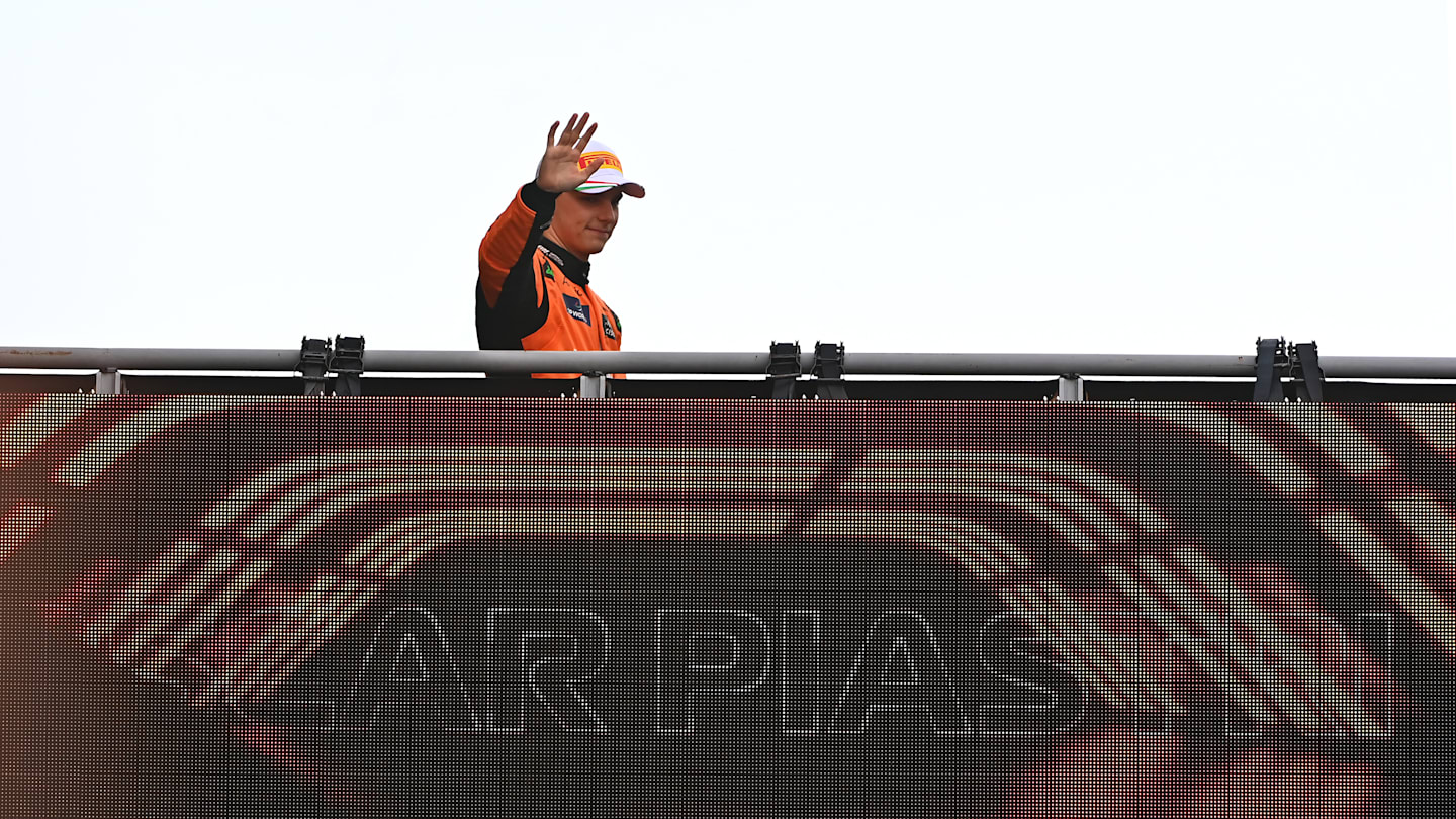 MONZA, ITALY - SEPTEMBER 01: Oscar Piastri of Australia and McLaren waves to fans as he walks to the podium during the F1 Grand Prix of Italy at Autodromo Nazionale Monza on September 01, 2024 in Monza, Italy. (Photo by James Sutton - Formula 1/Formula 1 via Getty Images)