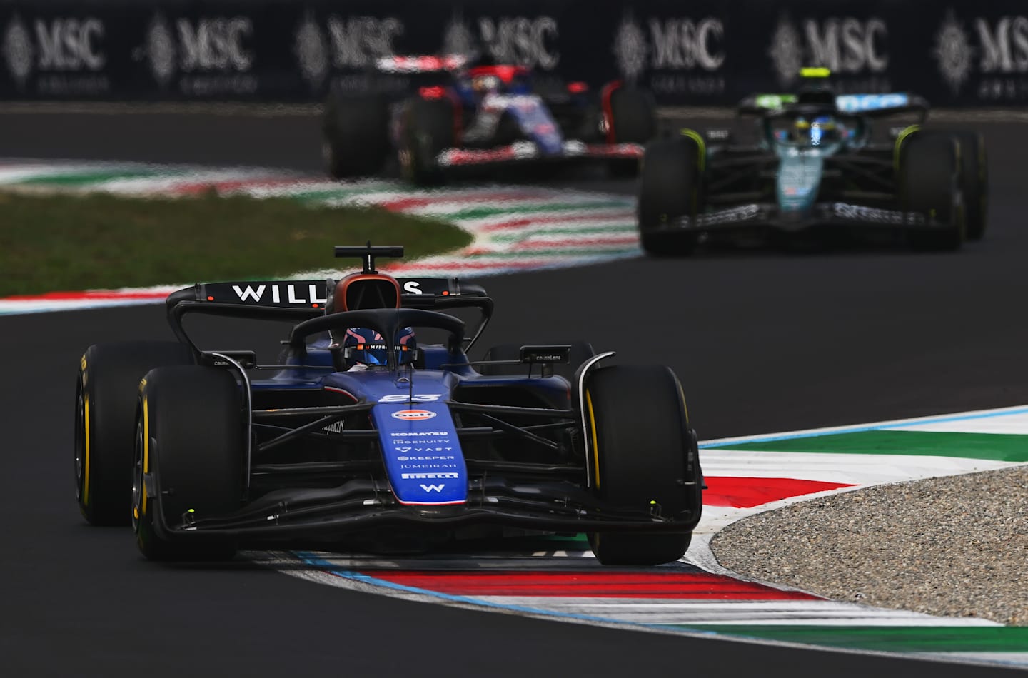 MONZA, ITALY - SEPTEMBER 01: Alexander Albon of Thailand driving the (23) Williams FW46 Mercedes leads Fernando Alonso of Spain driving the (14) Aston Martin AMR24 Mercedes during the F1 Grand Prix of Italy. (Photo by Rudy Carezzevoli/Getty Images)