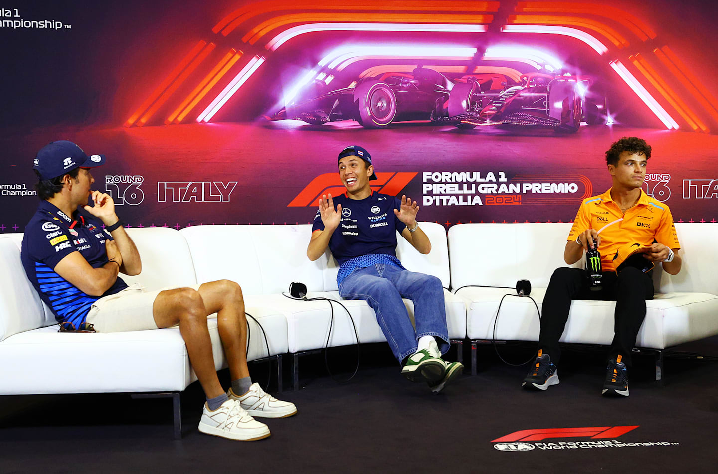 MONZA, ITALY - AUGUST 29: (L-R) Sergio Perez of Mexico and Oracle Red Bull Racing, Alexander Albon of Thailand and Williams, and Lando Norris of Great Britain and McLaren attend the Drivers Press Conference during previews ahead of the F1 Grand Prix of Italy at Autodromo Nazionale Monza on August 29, 2024 in Monza, Italy. (Photo by Clive Rose/Getty Images)