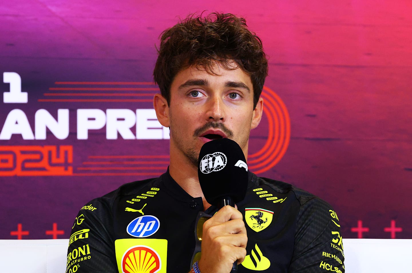 MONZA, ITALY - AUGUST 29: Charles Leclerc of Monaco and Ferrari attends the Drivers Press Conference during previews ahead of the F1 Grand Prix of Italy at Autodromo Nazionale Monza on August 29, 2024 in Monza, Italy. (Photo by Clive Rose/Getty Images)