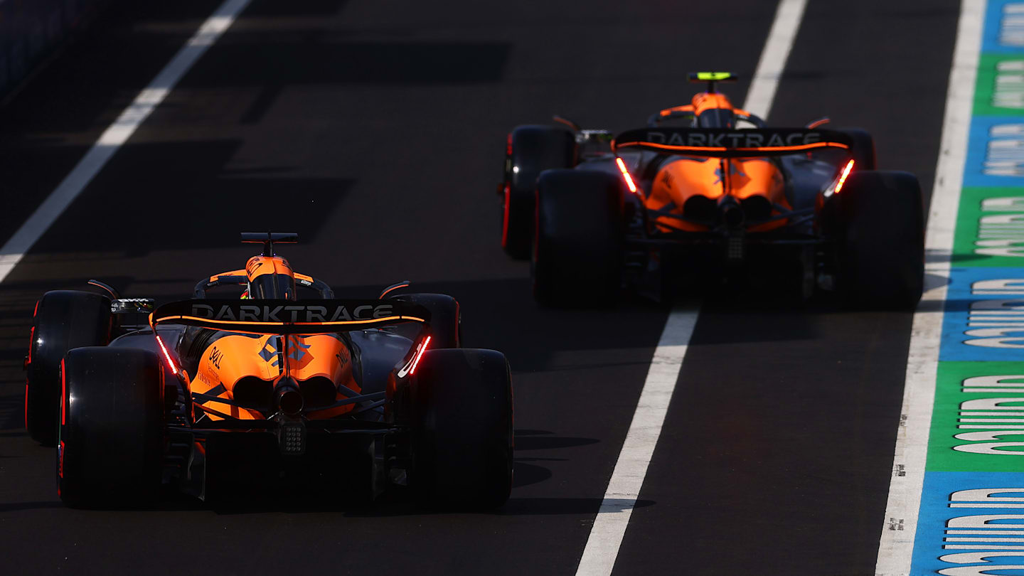 MONZA, ITALY - AUGUST 31: Lando Norris of Great Britain driving the (4) McLaren MCL38 Mercedes and Oscar Piastri of Australia driving the (81) McLaren MCL38 Mercedes in the Pitlane during qualifying ahead of the F1 Grand Prix of Italy at Autodromo Nazionale Monza on August 31, 2024 in Monza, Italy. (Photo by Bryn Lennon - Formula 1/Formula 1 via Getty Images)