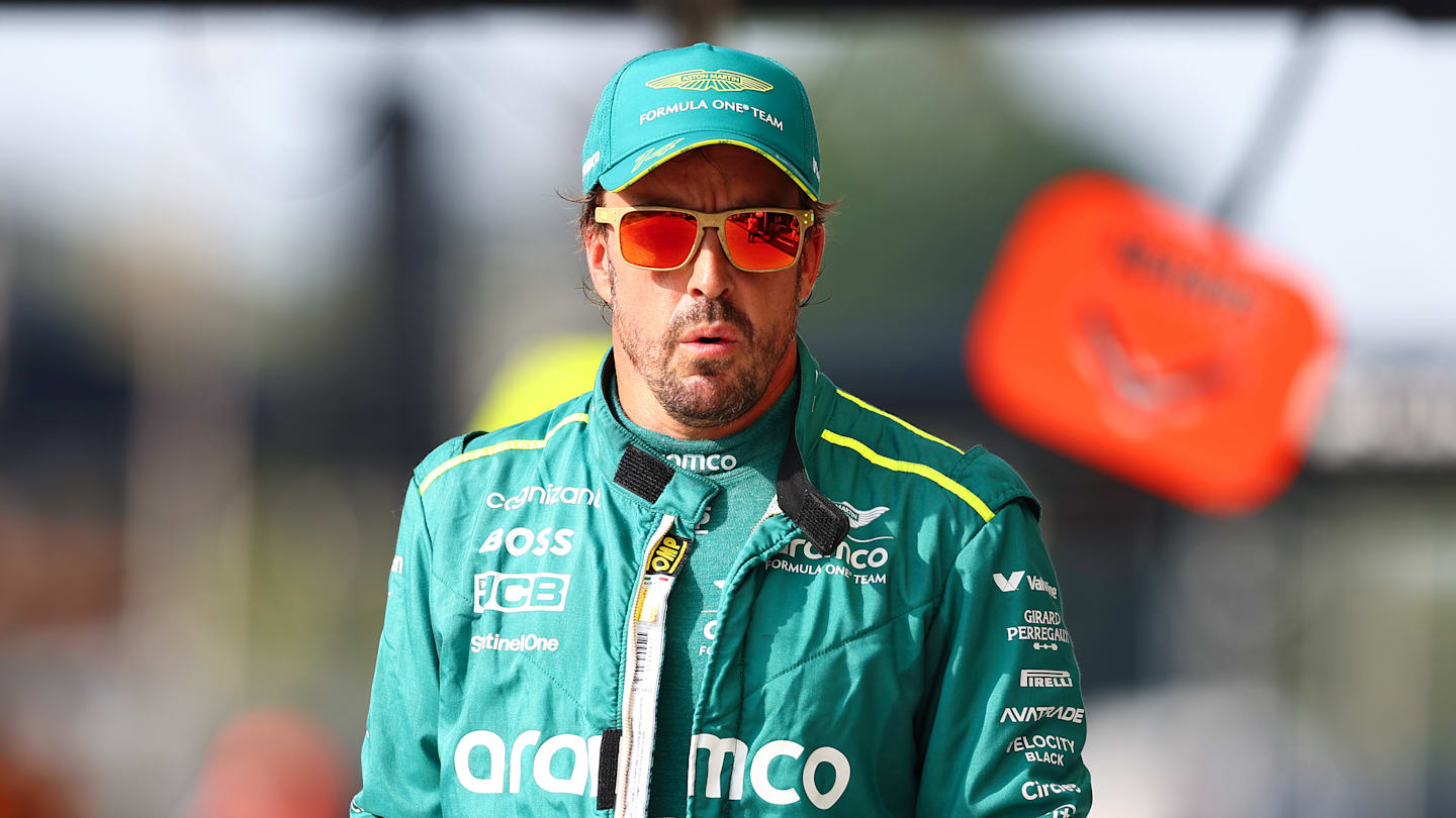 MONZA, ITALY - AUGUST 31: Fernando Alonso of Spain and Aston Martin F1 Team walks in the Pitlane