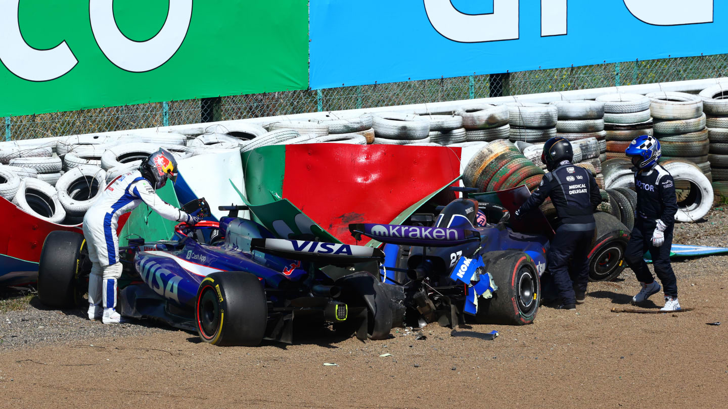 SUZUKA, JAPAN - APRIL 07: Daniel Ricciardo of Australia and Visa Cash App RB climbs out of his car after crashing with Alexander Albon of Thailand and Williams during the F1 Grand Prix of Japan at Suzuka International Racing Course on April 07, 2024 in Suzuka, Japan. (Photo by Clive Rose - Formula 1/Formula 1 via Getty Images)