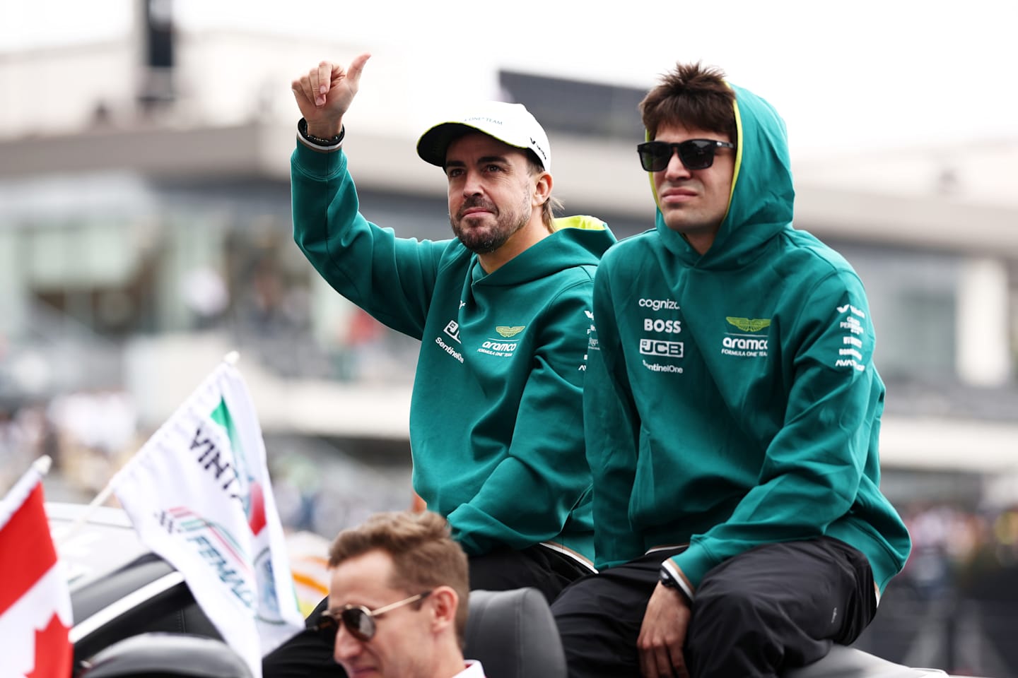 MEXICO CITY, MEXICO - OCTOBER 27: Fernando Alonso and Lance Stroll wave to the crowd on the drivers parade prior to the F1 Grand Prix of Mexico at Autodromo Hermanos Rodriguez on October 27, 2024 in Mexico City. (Photo by Jared C. Tilton/Getty Images)