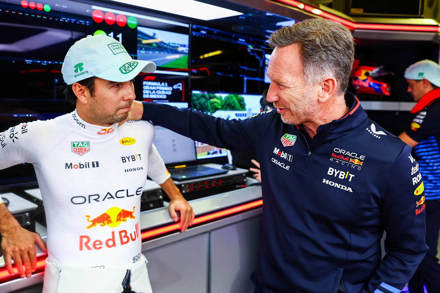 MEXICO CITY, MEXICO - OCTOBER 27: Sergio Perez and Oracle Red Bull Racing Team Principal Christian Horner talk in the garage prior to the F1 Grand Prix of Mexico on October 27, 2024 in Mexico City, Mexico. (Photo by Mark Thompson/Getty Images)
