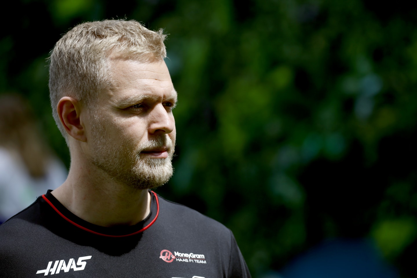 MIAMI, FLORIDA - MAY 05: Kevin Magnussen of Denmark and Haas F1 walks in the Paddock prior to the