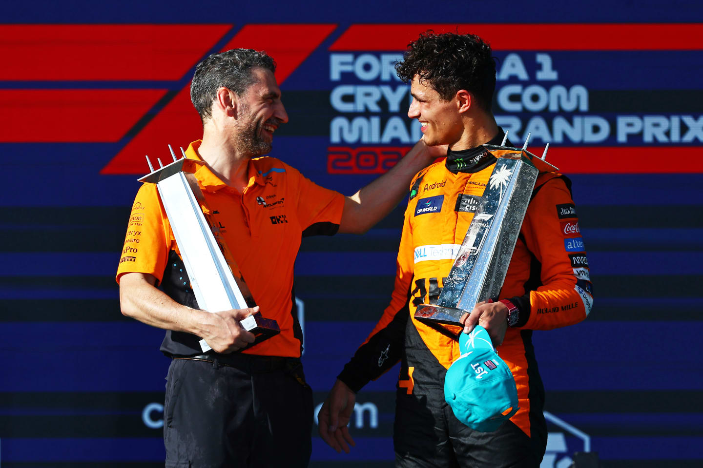 MIAMI, FLORIDA - MAY 05: Race winner Lando Norris of Great Britain and McLaren celebrates with McLaren Team Principal Andrea Stella on the podium after the F1 Grand Prix of Miami at Miami International Autodrome on May 05, 2024 in Miami, Florida. (Photo by Mark Thompson/Getty Images)