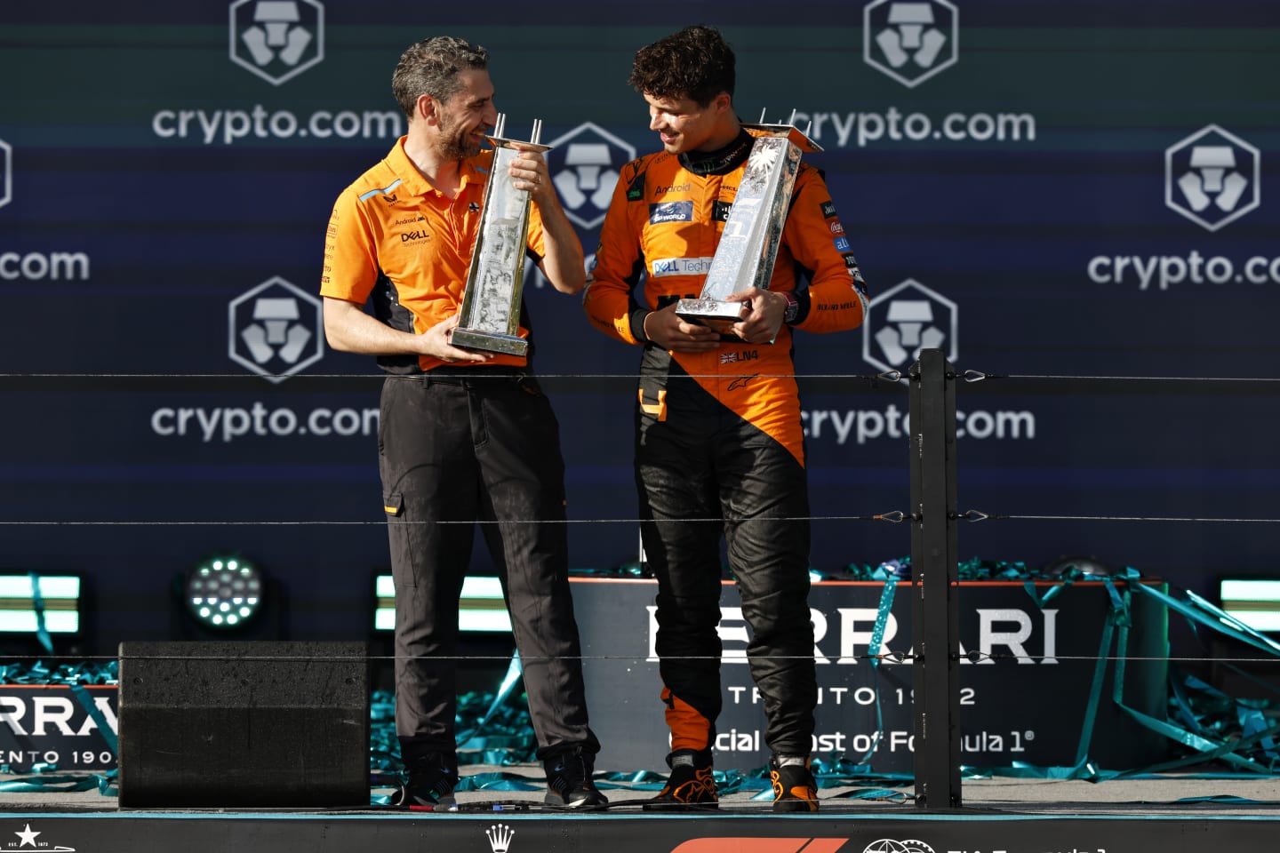MIAMI, FLORIDA - MAY 05: Race winner Lando Norris of Great Britain and McLaren and McLaren Team Principal Andrea Stella celebrate on the podium after the F1 Grand Prix of Miami at Miami International Autodrome on May 05, 2024 in Miami, Florida. (Photo by Chris Graythen/Getty Images)