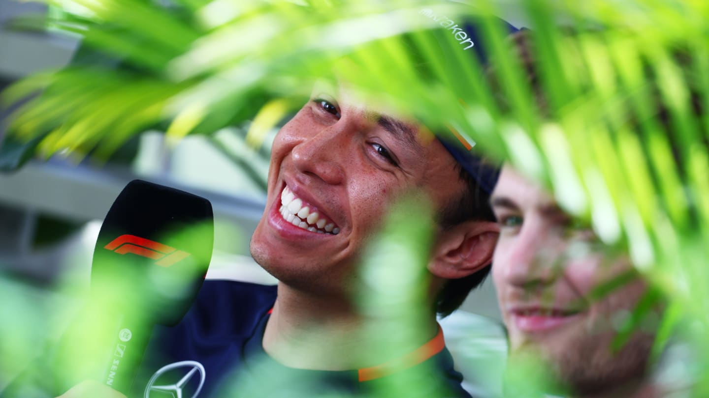 MIAMI, FLORIDA - MAY 03: Alexander Albon of Thailand and Williams talks to the media in the Paddock