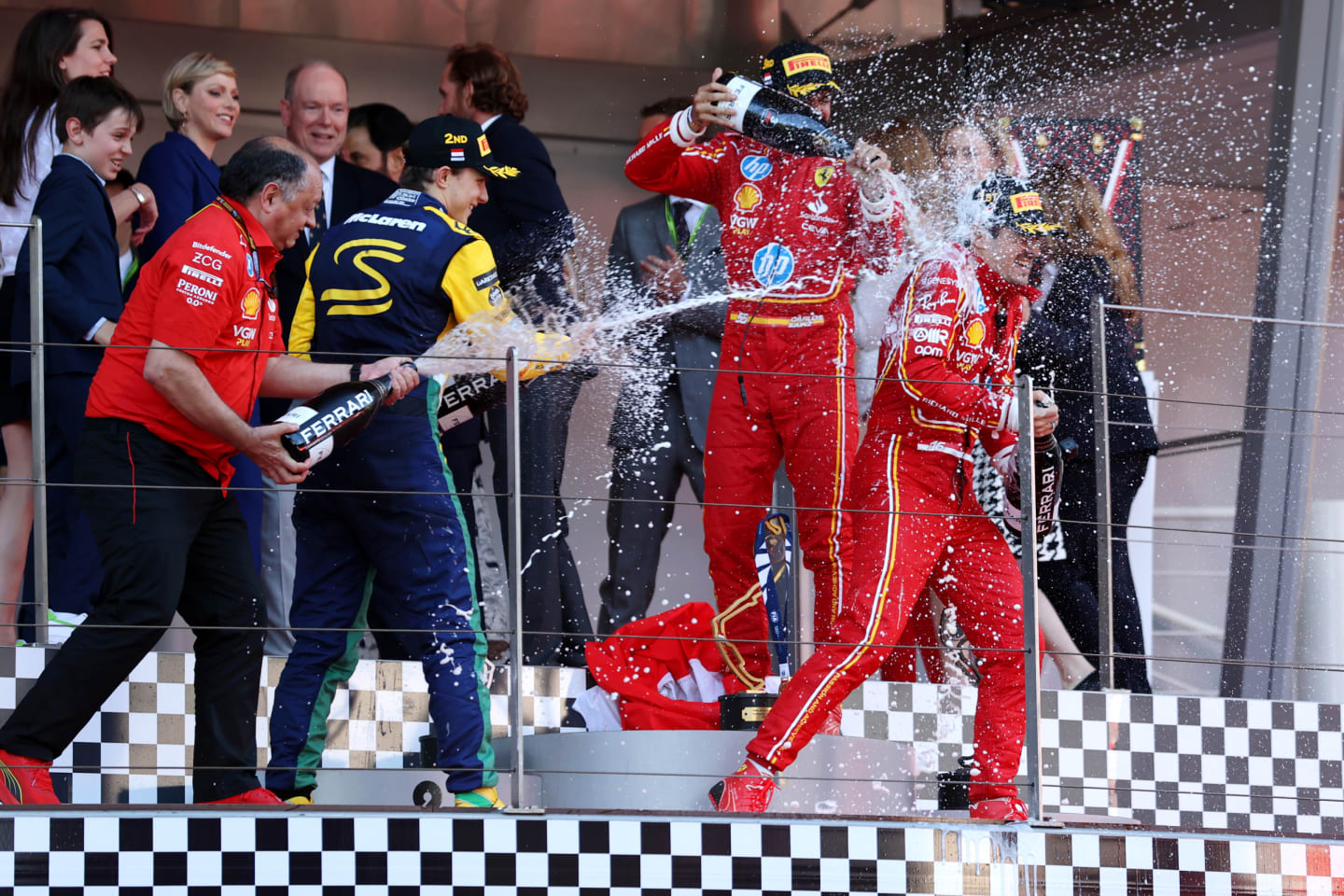 MONTE-CARLO, MONACO - MAY 26: Race winner Charles Leclerc of Monaco and Ferrari, Second placed Second placed Oscar Piastri of Australia and McLaren, Third placed Carlos Sainz of Spain and Ferrari and Ferrari Team Principal Frederic Vasseur celebrate on the podium during the F1 Grand Prix of Monaco at Circuit de Monaco on May 26, 2024 in Monte-Carlo, Monaco. (Photo by Ryan Pierse/Getty Images)