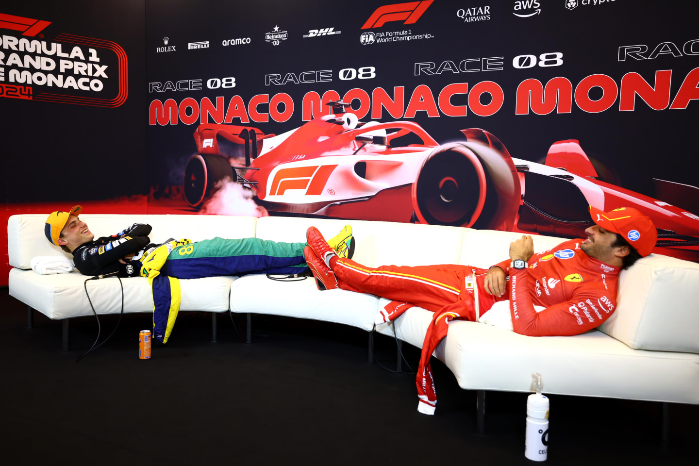 MONTE-CARLO, MONACO - MAY 26: Second placed Oscar Piastri of Australia and McLaren and Third placed Carlos Sainz of Spain and Ferrari wait for Race winner Charles Leclerc of Monaco and Ferrari to arrive in the press conference after the F1 Grand Prix of Monaco at Circuit de Monaco on May 26, 2024 in Monte-Carlo, Monaco. (Photo by Clive Rose/Getty Images)