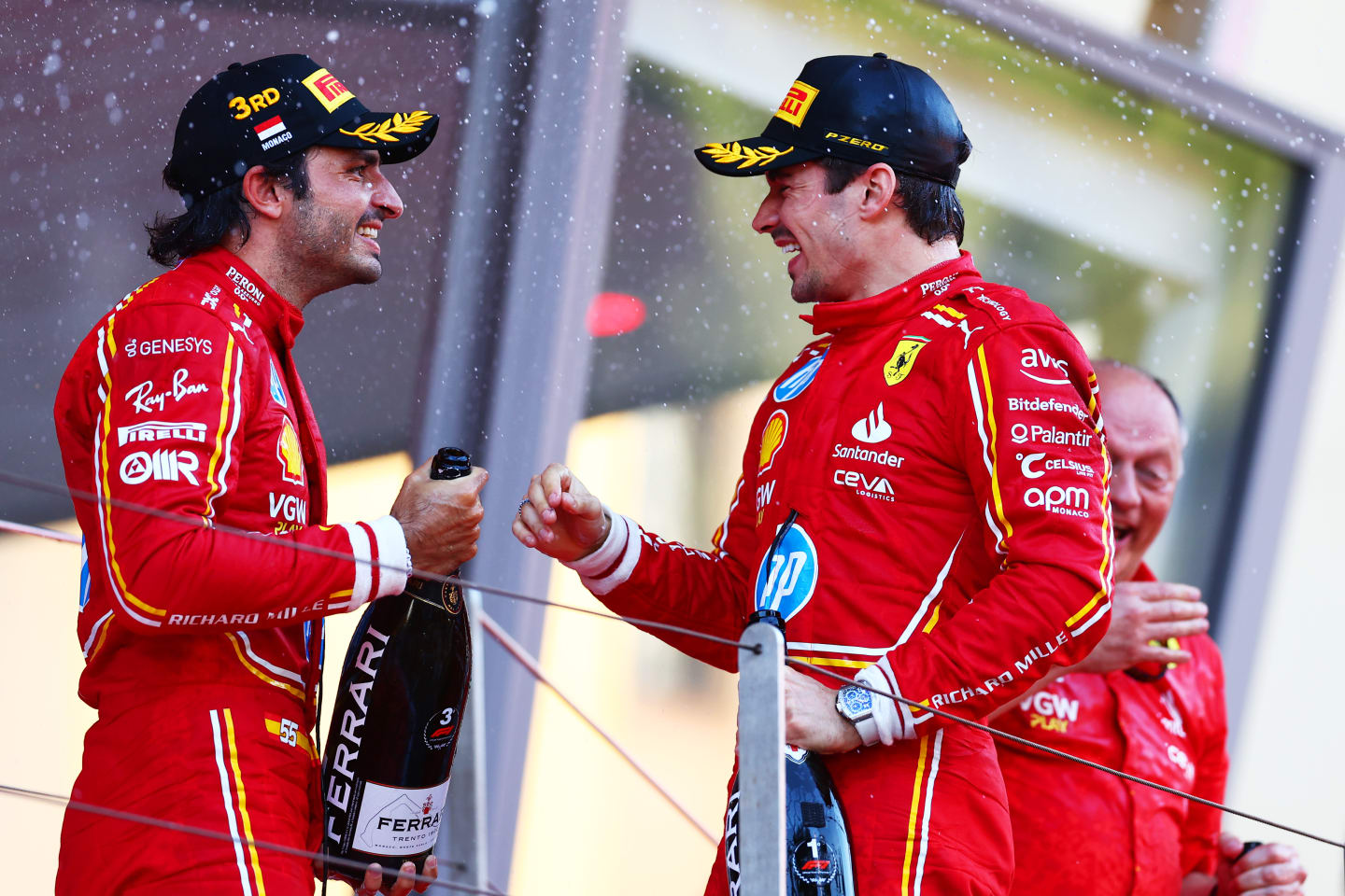 MONTE-CARLO, MONACO - MAY 26: Race winner Charles Leclerc of Monaco and Ferrari and Third placed Carlos Sainz of Spain and Ferrari celebrate on the podium during the F1 Grand Prix of Monaco at Circuit de Monaco on May 26, 2024 in Monte-Carlo, Monaco. (Photo by Bryn Lennon - Formula 1/Formula 1 via Getty Images)