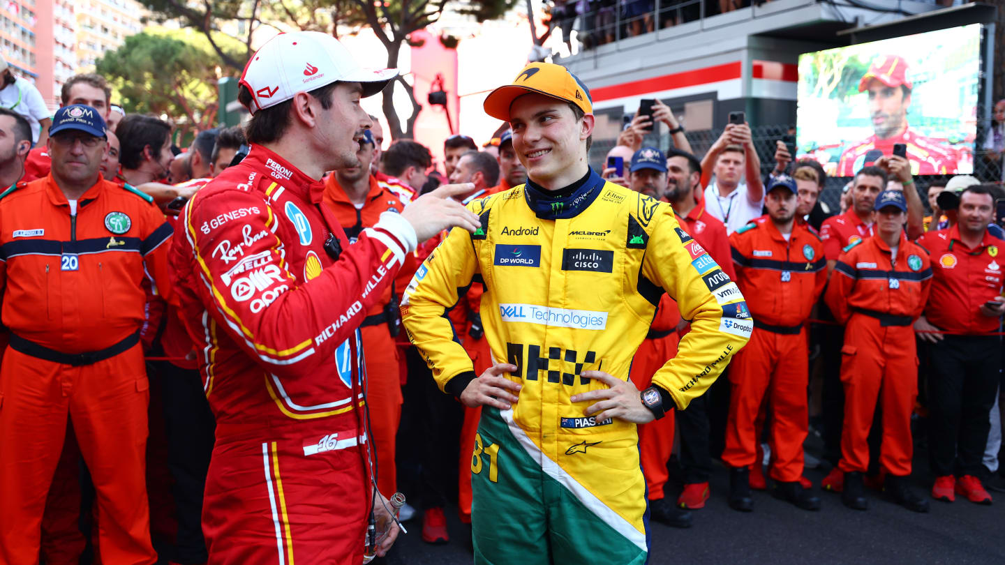 MONTE-CARLO, MONACO - MAY 26: Race winner Charles Leclerc of Monaco and Ferrari and Second placed Oscar Piastri of Australia and McLaren celebrate in parc ferme during the F1 Grand Prix of Monaco at Circuit de Monaco on May 26, 2024 in Monte-Carlo, Monaco. (Photo by Bryn Lennon - Formula 1/Formula 1 via Getty Images)