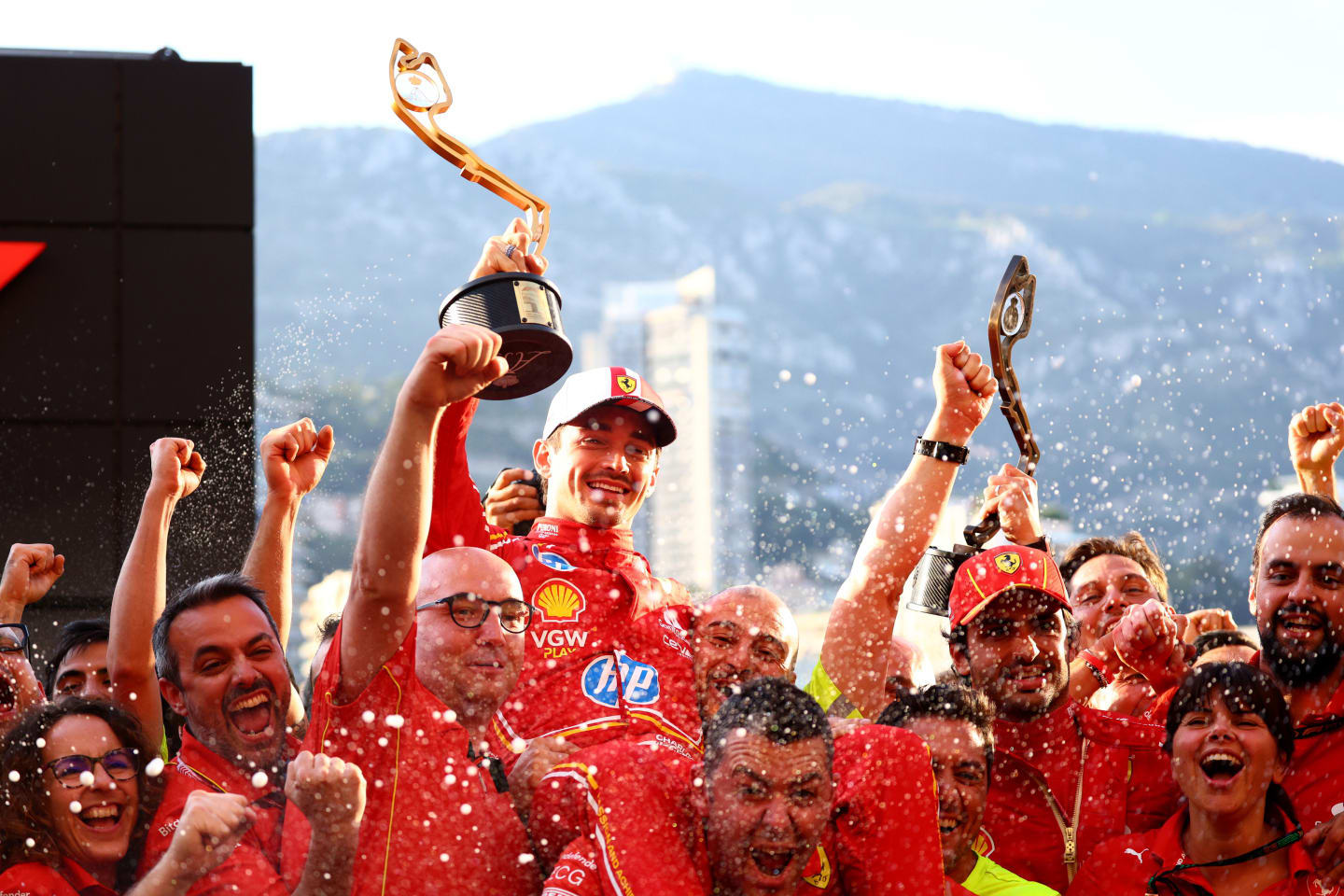 MONTE-CARLO, MONACO - MAY 26: Race winner Charles Leclerc of Monaco and Ferrari celebrates with his team after the F1 Grand Prix of Monaco at Circuit de Monaco on May 26, 2024 in Monte-Carlo, Monaco. (Photo by Clive Rose/Getty Images)