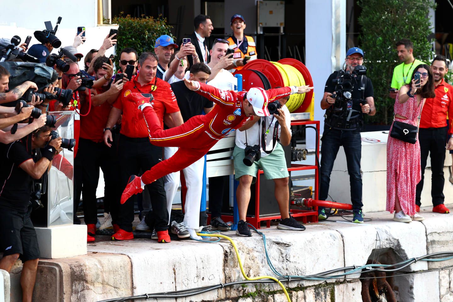 MONTE-CARLO, MONACO - MAY 26: Race winner Charles Leclerc of Monaco and Ferrari celebrates by jumping in the harbour after the F1 Grand Prix of Monaco at Circuit de Monaco on May 26, 2024 in Monte-Carlo, Monaco. (Photo by Clive Rose/Getty Images)
