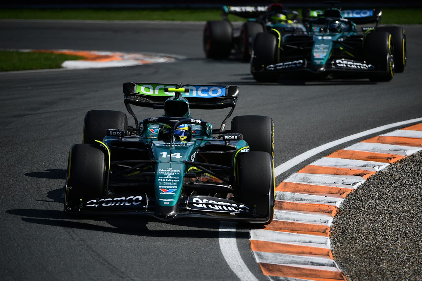 ZANDVOORT, NETHERLANDS - AUGUST 25: Fernando Alonso of Spain driving the (14) Aston Martin AMR24 Mercedes leads Lance Stroll of Canada driving the (18) Aston Martin AMR24 Mercedes during the F1 Grand Prix of Netherlands at Circuit Zandvoort on August 25, 2024 in Zandvoort, Netherlands. (Photo by James Sutton - Formula 1/Formula 1 via Getty Images)