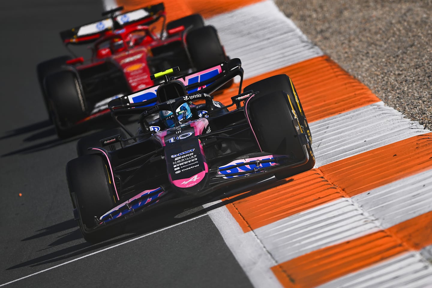 ZANDVOORT, NETHERLANDS - AUGUST 25: Pierre Gasly of France driving the (10) Alpine F1 A524 Renault leads Charles Leclerc of Monaco driving the (16) Ferrari SF-24 during the F1 Grand Prix of Netherlands at Circuit Zandvoort on August 25, 2024 in Zandvoort, Netherlands. (Photo by Rudy Carezzevoli/Getty Images)