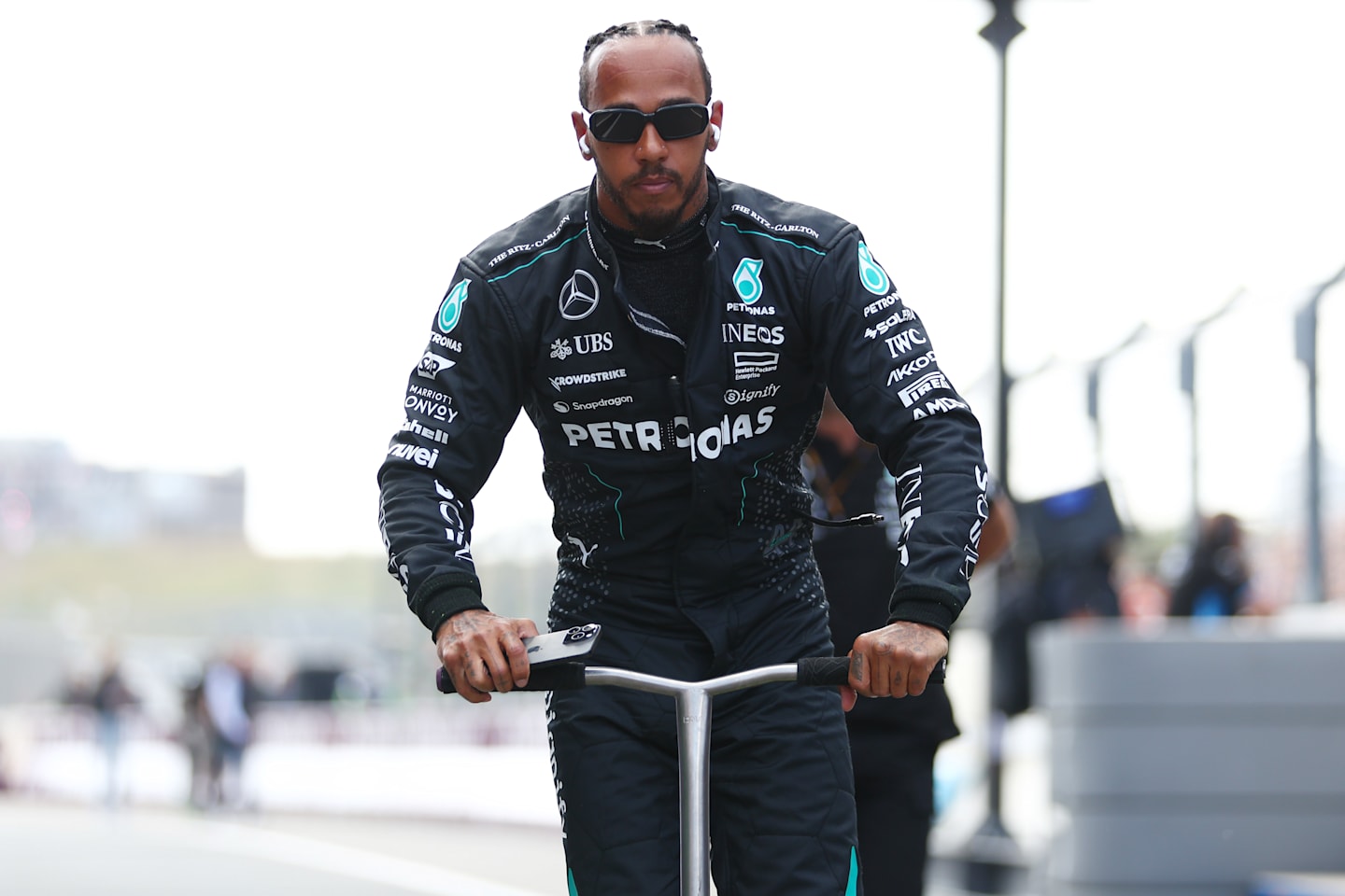 ZANDVOORT, NETHERLANDS - AUGUST 25: Lewis Hamilton of Great Britain and Mercedes rides a scooter in