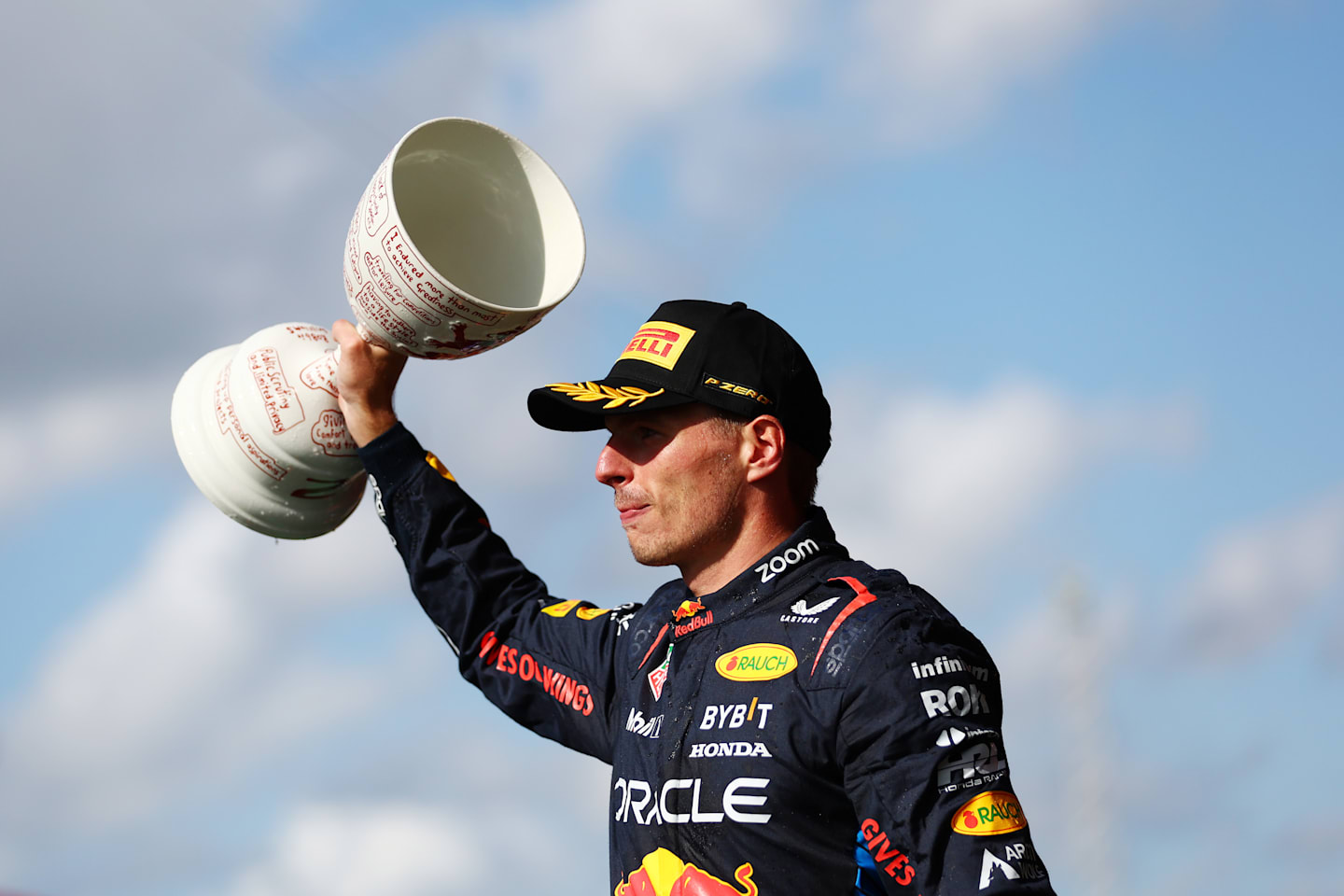 ZANDVOORT, NETHERLANDS - AUGUST 25: Second placed Max Verstappen of the Netherlands and Oracle Red Bull Racing celebrates in parc ferme after the F1 Grand Prix of Netherlands at Circuit Zandvoort on August 25, 2024 in Zandvoort, Netherlands. (Photo by Bryn Lennon - Formula 1/Formula 1 via Getty Images)