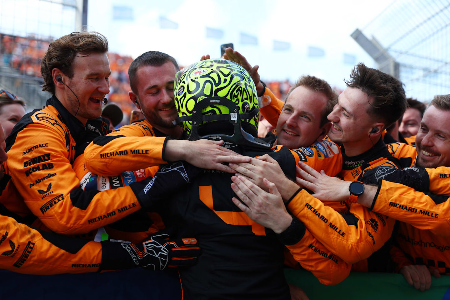 ZANDVOORT, NETHERLANDS - AUGUST 25: Race winner Lando Norris of Great Britain and McLaren celebrates with Team McLaren in parc ferme after the F1 Grand Prix of Netherlands at Circuit Zandvoort on August 25, 2024 in Zandvoort, Netherlands. (Photo by Bryn Lennon - Formula 1/Formula 1 via Getty Images)