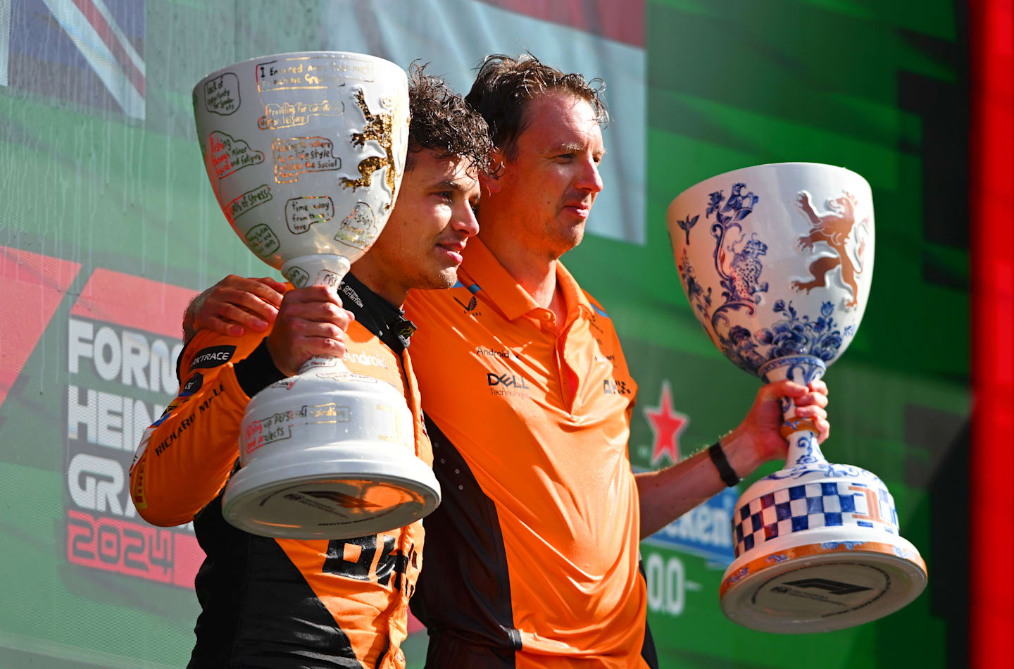 ZANDVOORT, NETHERLANDS - AUGUST 25: Race winner Lando Norris of Great Britain and McLaren and Will Joseph, Director, Race Engineering at McLaren celebrate in parc ferme after the F1 Grand Prix of Netherlands at Circuit Zandvoort on August 25, 2024 in Zandvoort, Netherlands. (Photo by Rudy Carezzevoli/Getty Images)