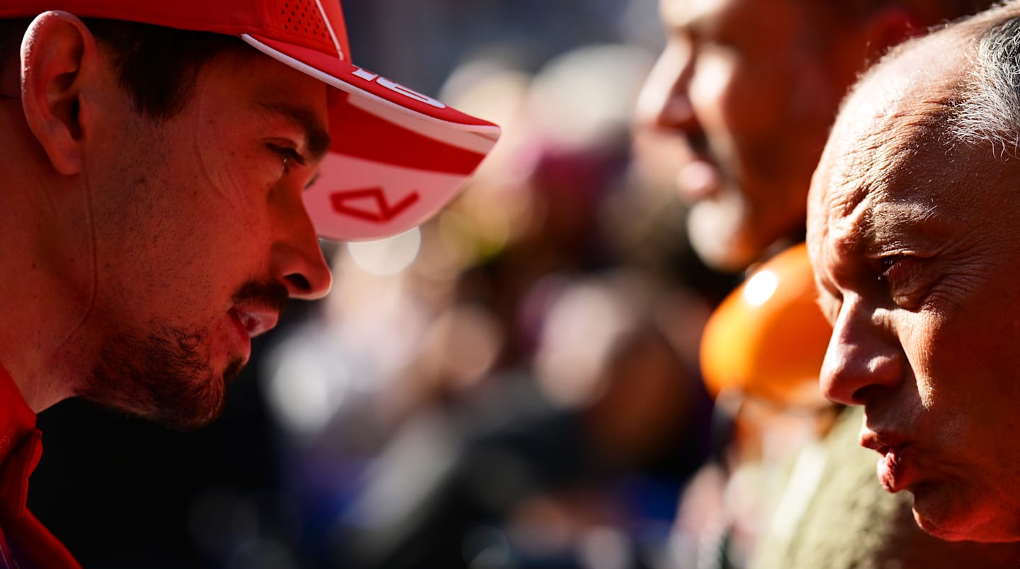 ZANDVOORT, NETHERLANDS - AUGUST 25: Charles Leclerc of Monaco and Ferrari talks with Ferrari Team