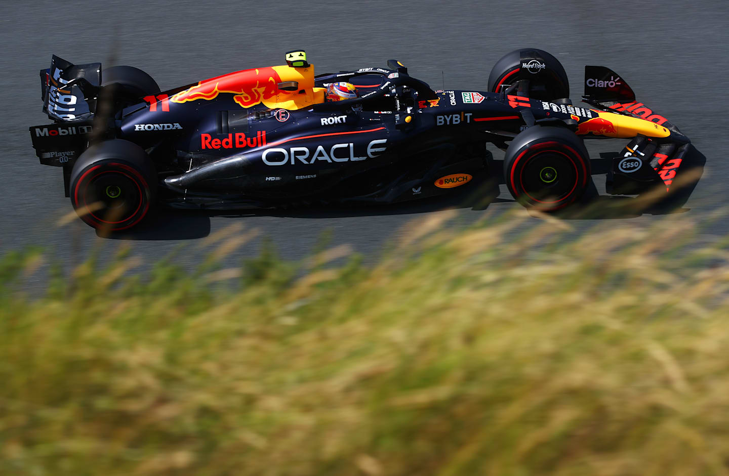 ZANDVOORT, NETHERLANDS - AUGUST 23: Sergio Perez of Mexico driving the (11) Oracle Red Bull Racing RB20 on track during practice ahead of the F1 Grand Prix of Netherlands at Circuit Zandvoort on August 23, 2024 in Zandvoort, Netherlands. (Photo by Joe Portlock/Getty Images)