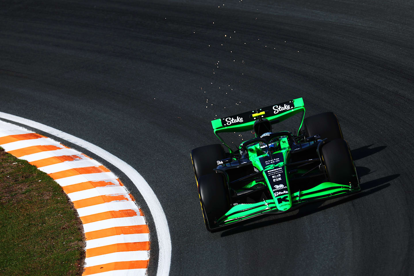 ZANDVOORT, NETHERLANDS - AUGUST 23: Sparks fly behind Zhou Guanyu of China driving the (24) Kick Sauber C44 Ferrari on track during practice ahead of the F1 Grand Prix of Netherlands at Circuit Zandvoort on August 23, 2024 in Zandvoort, Netherlands. (Photo by Clive Rose/Getty Images)