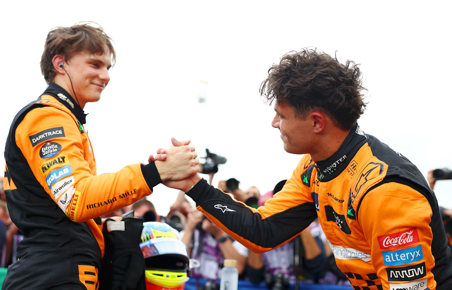 ZANDVOORT, NETHERLANDS - AUGUST 24: Pole position qualifier Lando Norris of Great Britain and McLaren interacts with third placed qualifier Oscar Piastri of Australia and McLaren in parc ferme after qualifying ahead of the F1 Grand Prix of Netherlands at Circuit Zandvoort on August 24, 2024 in Zandvoort, Netherlands. (Photo by Bryn Lennon - Formula 1/Formula 1 via Getty Images)