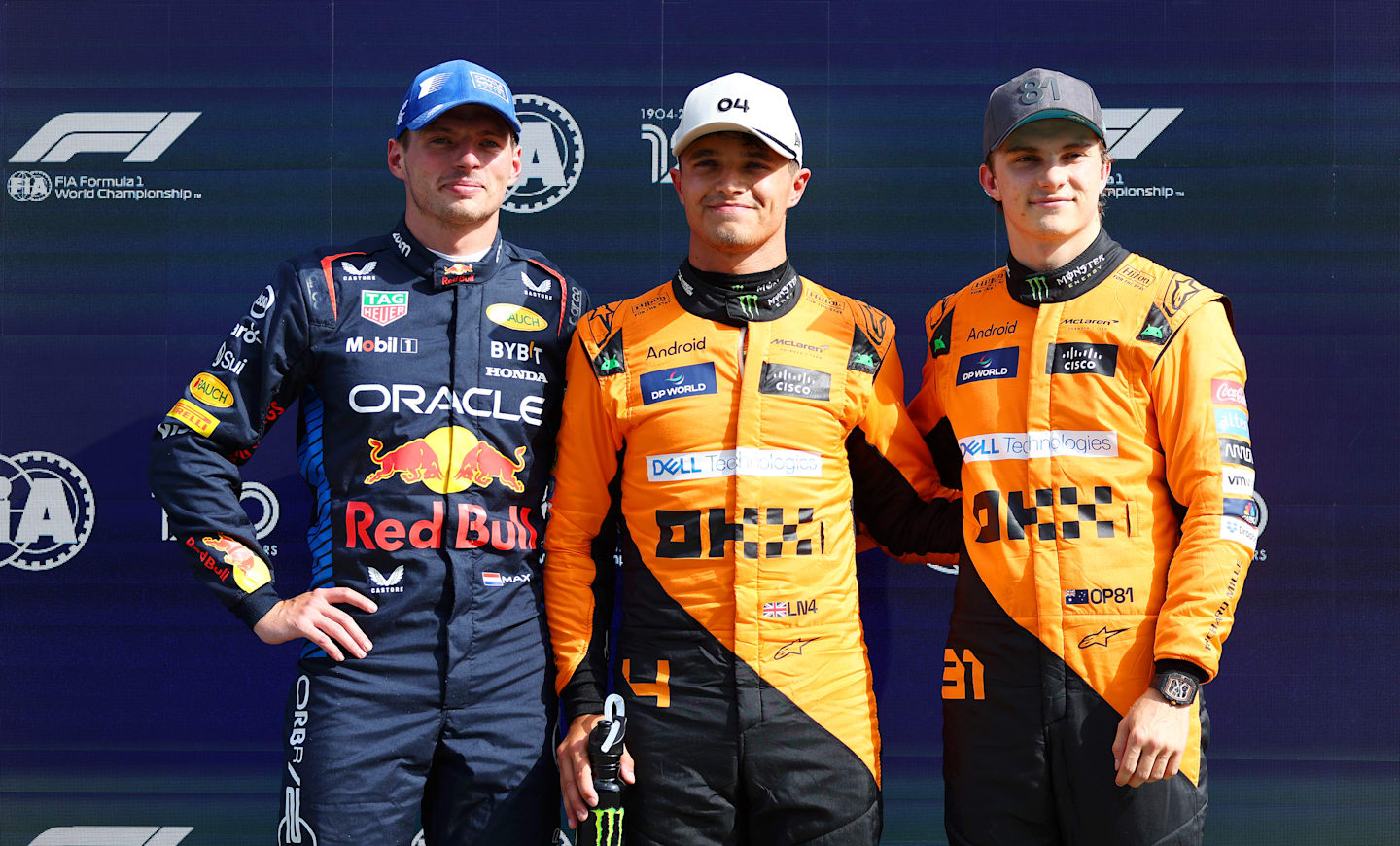 ZANDVOORT, NETHERLANDS - AUGUST 24: Second placed qualifier Max Verstappen of the Netherlands and Oracle Red Bull Racing, pole position qualifier Lando Norris of Great Britain and McLaren and third placed qualifier Oscar Piastri of Australia and McLaren pose for a photo in parc ferme after qualifying ahead of the F1 Grand Prix of Netherlands at Circuit Zandvoort on August 24, 2024 in Zandvoort, Netherlands. (Photo by Bryn Lennon - Formula 1/Formula 1 via Getty Images)