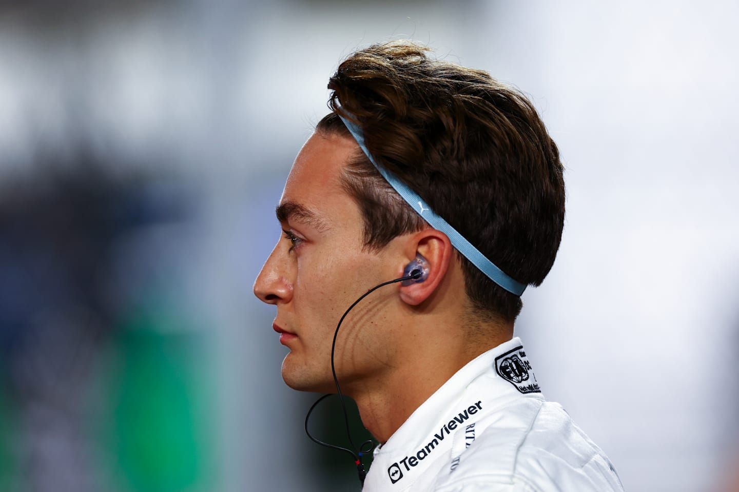 LUSAIL CITY, QATAR - DECEMBER 01: George Russell of Great Britain and Mercedes looks on on the grid