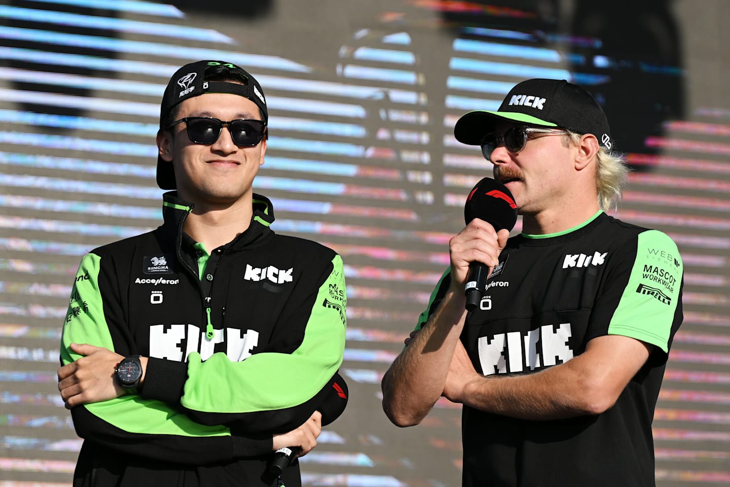 Zhou Guanyu and Valtteri Bottas talk on the fan stage prior to practice ahead of the F1 Grand Prix of Qatar at Lusail International Circuit on November 29, 2024 in Lusail City, Qatar. (Photo by Mark Sutton - Formula 1/Formula 1 via Getty Images)