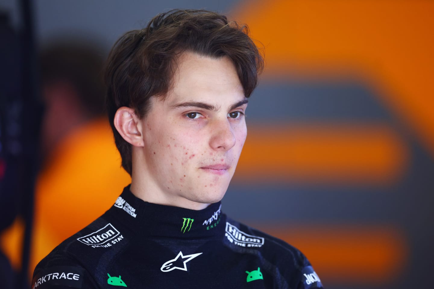 BARCELONA, SPAIN - JUNE 22: Oscar Piastri of Australia and McLaren looks on in the garage during final practice ahead of the F1 Grand Prix of Spain at Circuit de Barcelona-Catalunya on June 22, 2024 in Barcelona, Spain. (Photo by Clive Rose - Formula 1/Formula 1 via Getty Images)