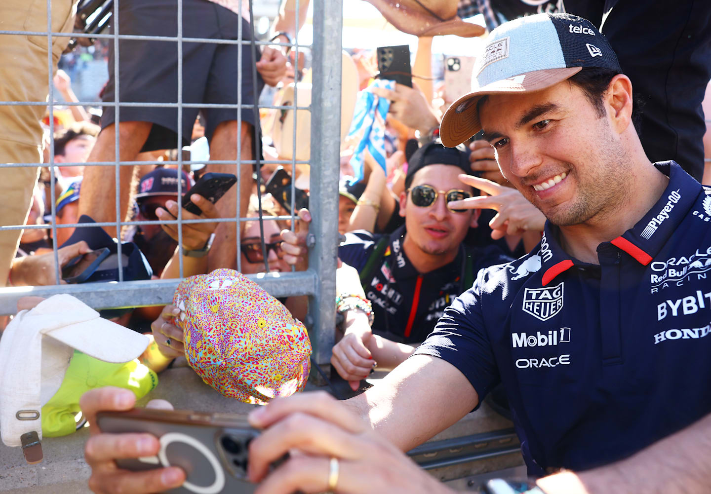 AUSTIN, TEXAS - OCTOBER 20: Sergio Perez of Mexico and Oracle Red Bull Racing takes a photo with
