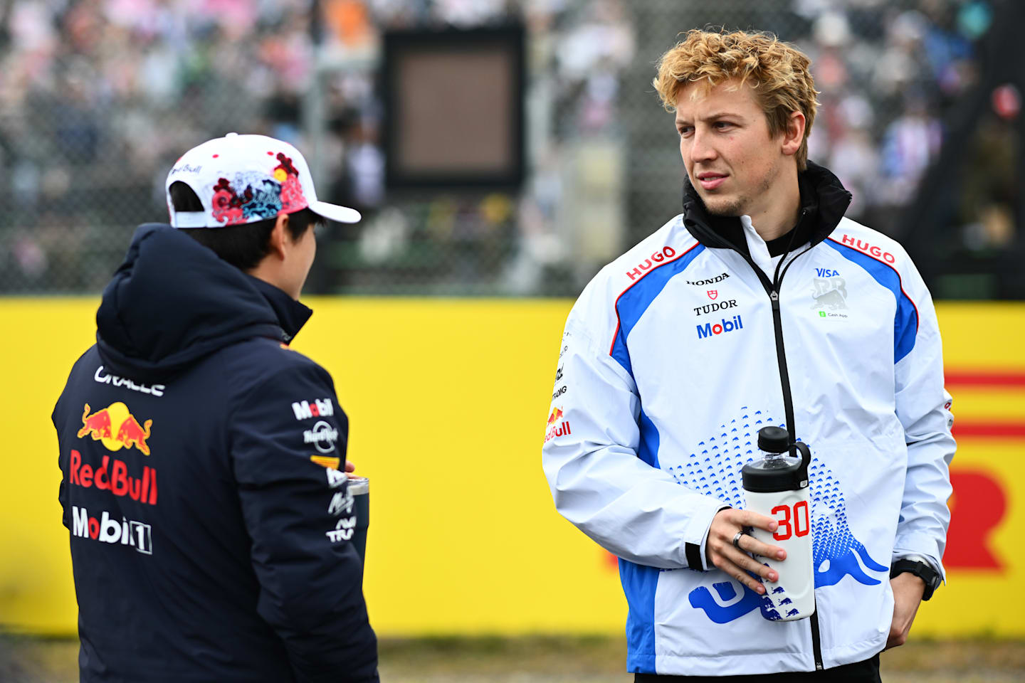 SUZUKA, JAPAN - APRIL 06: Yuki Tsunoda of Japan and Oracle Red Bull Racing and Liam Lawson of New
