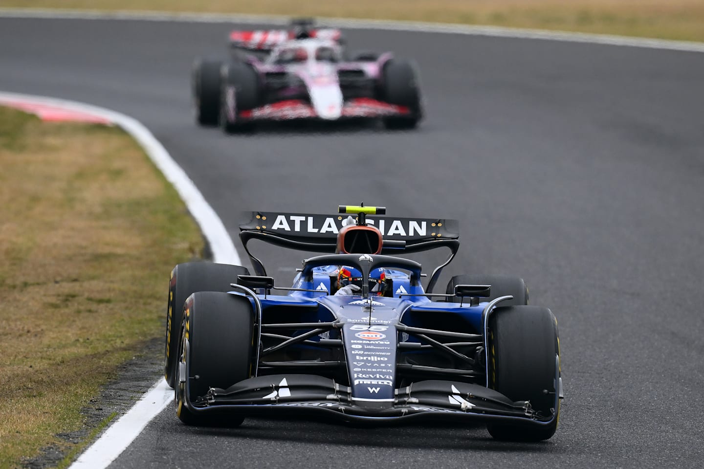 SUZUKA, JAPAN - APRIL 06: Carlos Sainz of Spain driving the (55) Williams FW47 Mercedes leads
