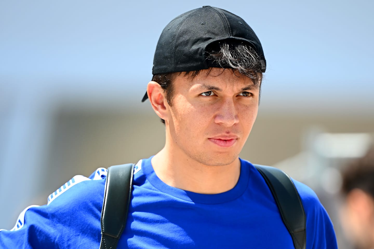 SUZUKA, JAPAN - APRIL 03: Alexander Albon of Thailand and Williams looks on in the Paddock during