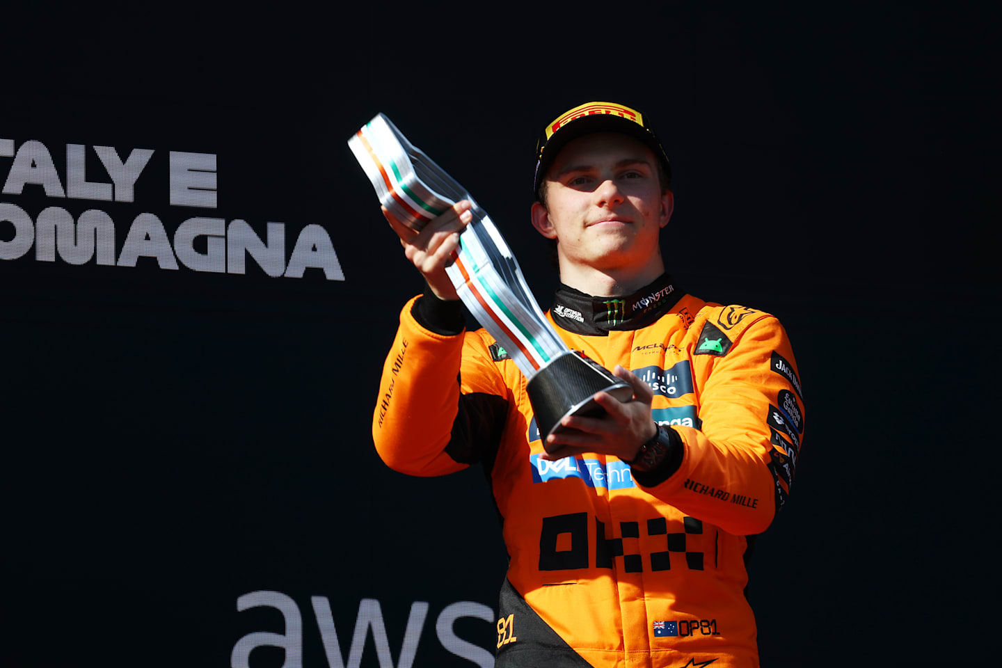 IMOLA, ITALY - MAY 18: Third placed Oscar Piastri of Australia and McLaren lifts his trophy on the