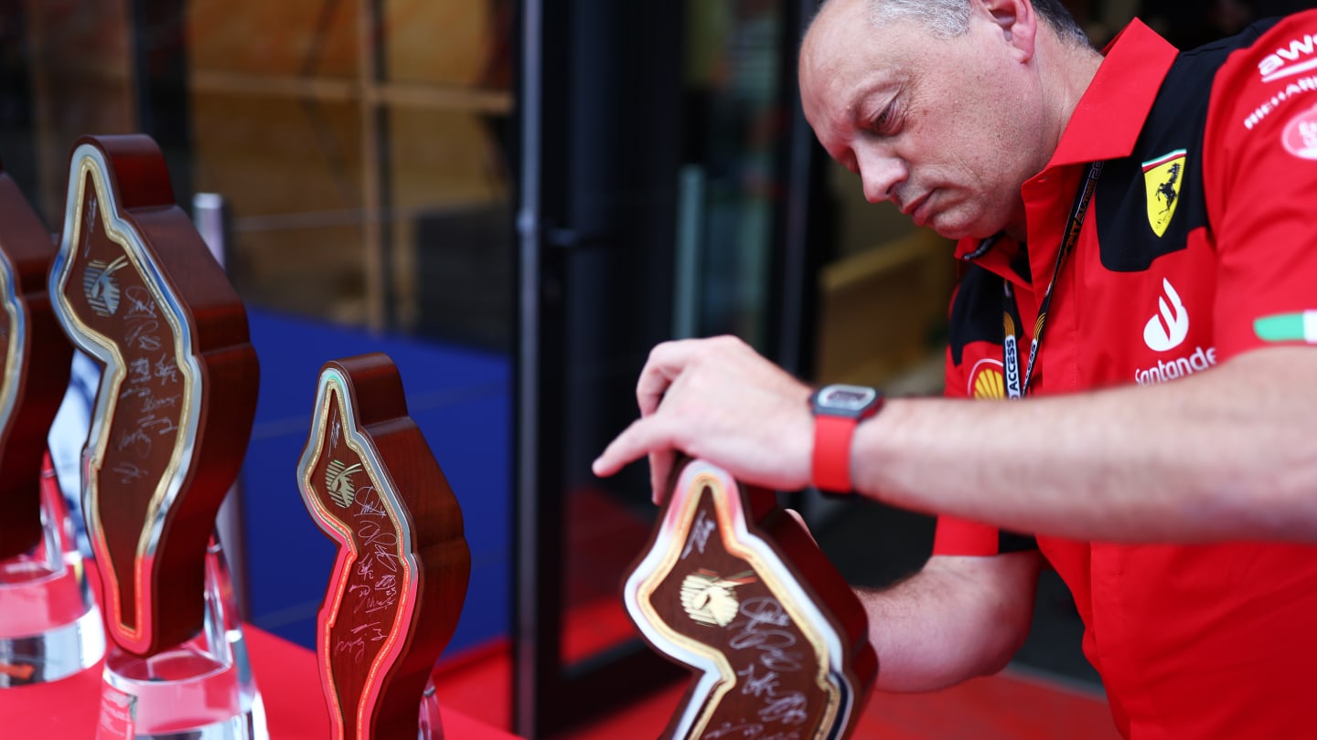 BARCELONA, SPAIN - JUNE 02: Ferrari Team Principal Frederic Vasseur signs an autograph on a trophy