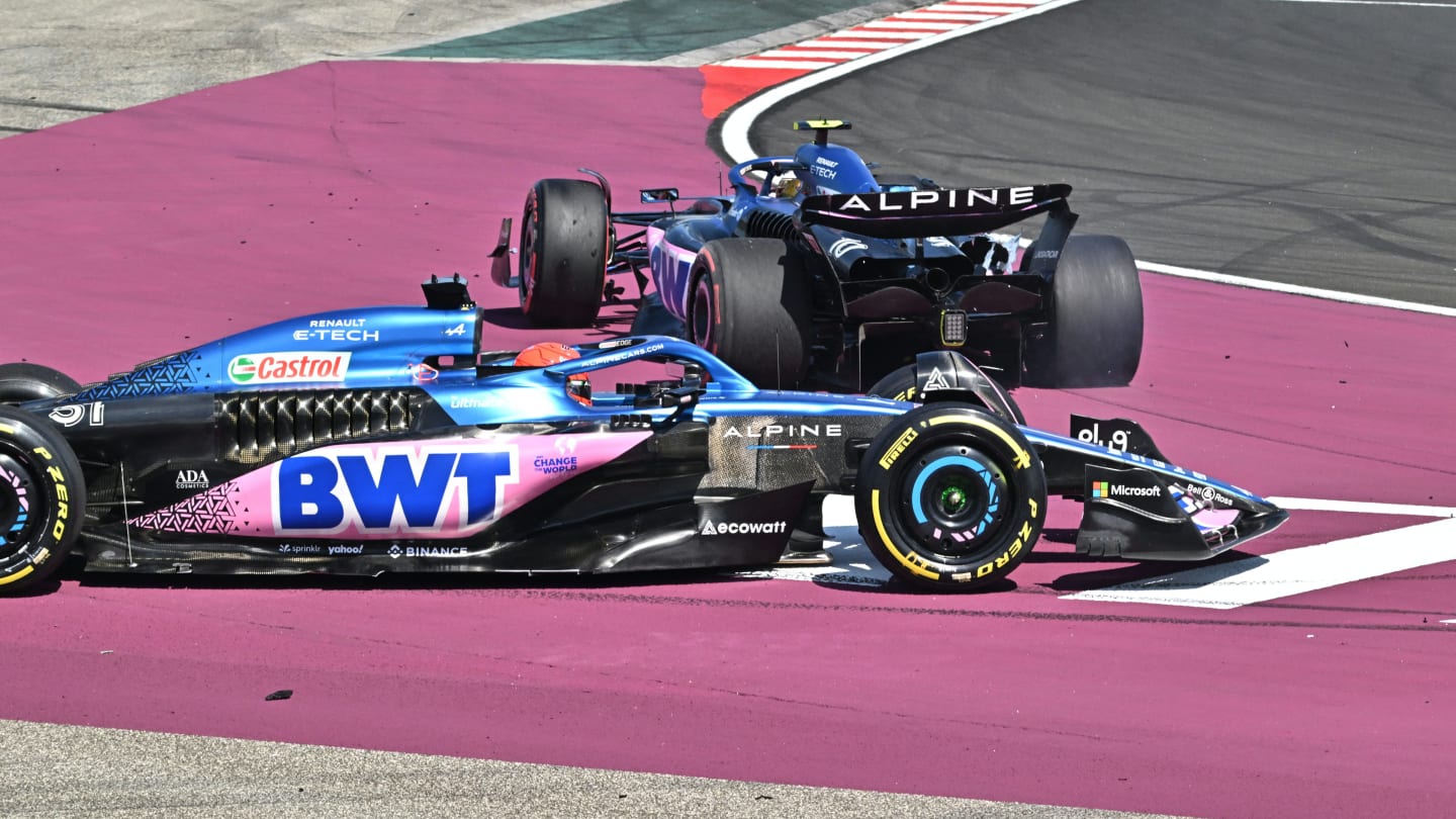 Alpines's French driver Pierre Gasly (background) and Alpine's French driver Esteban Ocon collide