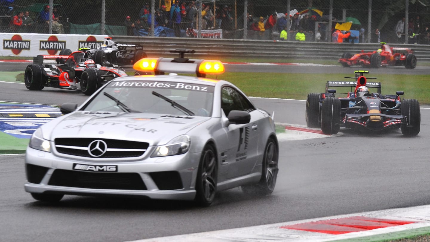 Competitors drive behind the safety car before the start of the Italian Formula One Grand Prix, at