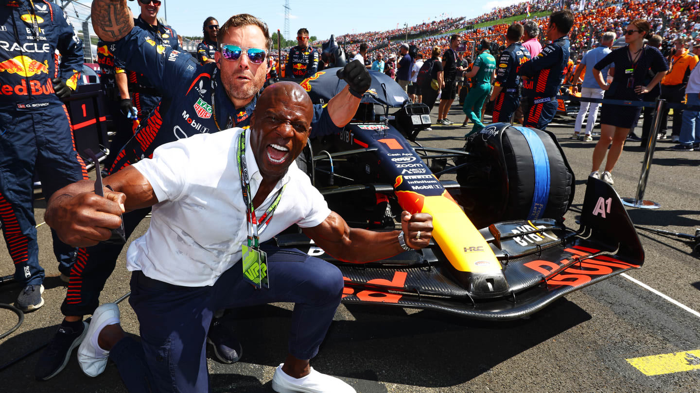 BUDAPEST, HUNGARY - JULY 23: Terry Crews poses for a photo with the car of Max Verstappen of the