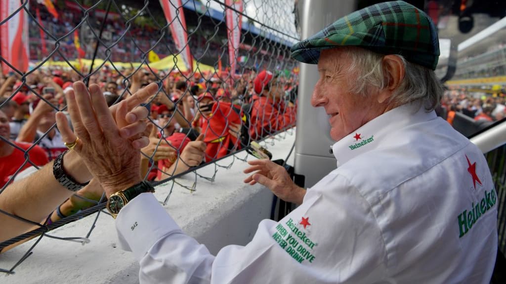 British former F1 driver Jackie Stewart greets fans during the Italian Formula One Grand Prix at