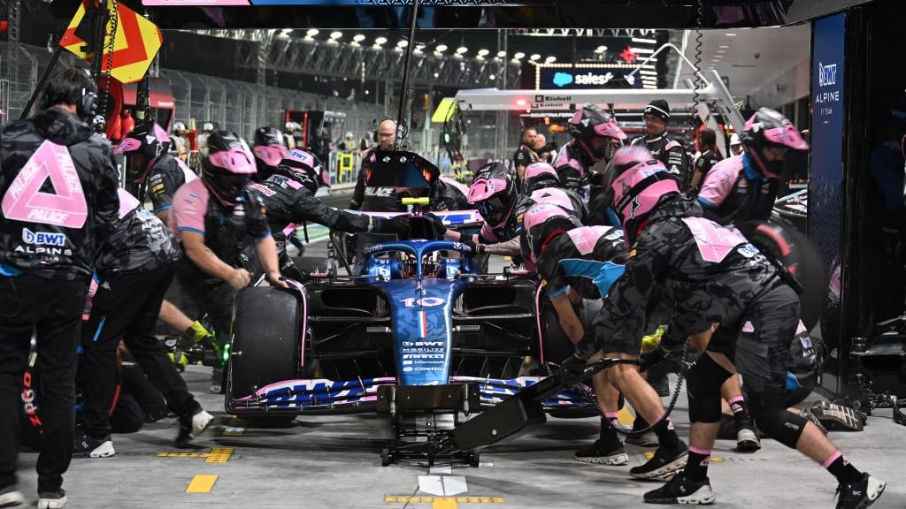 Mechanics work on the car of Alpine's French driver Pierre Gasly in the pits during the second