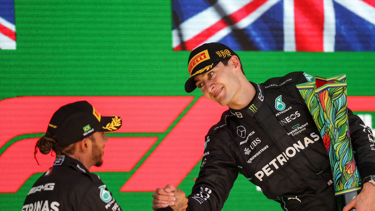 SAO PAULO, BRAZIL - NOVEMBER 13: Lewis Hamilton of Mercedes and Great Britain congratulates George